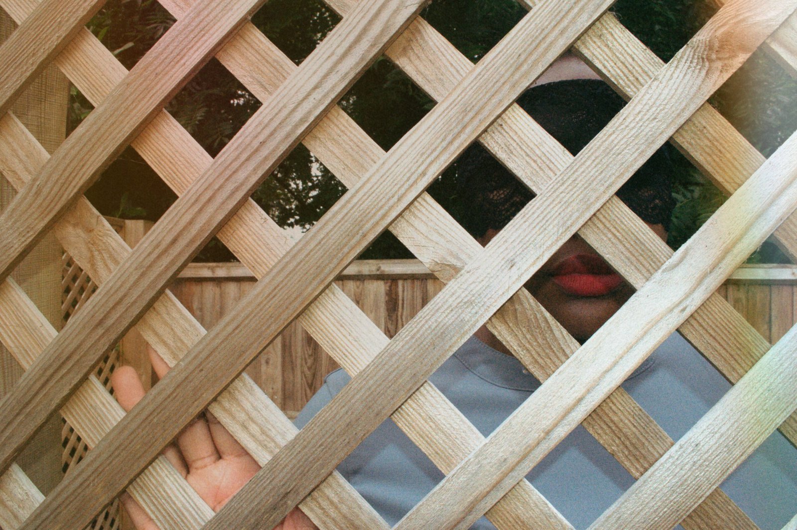 Masked Dominatrix in lace, creating mysterious atmosphere for Cambridge BDSM sessions