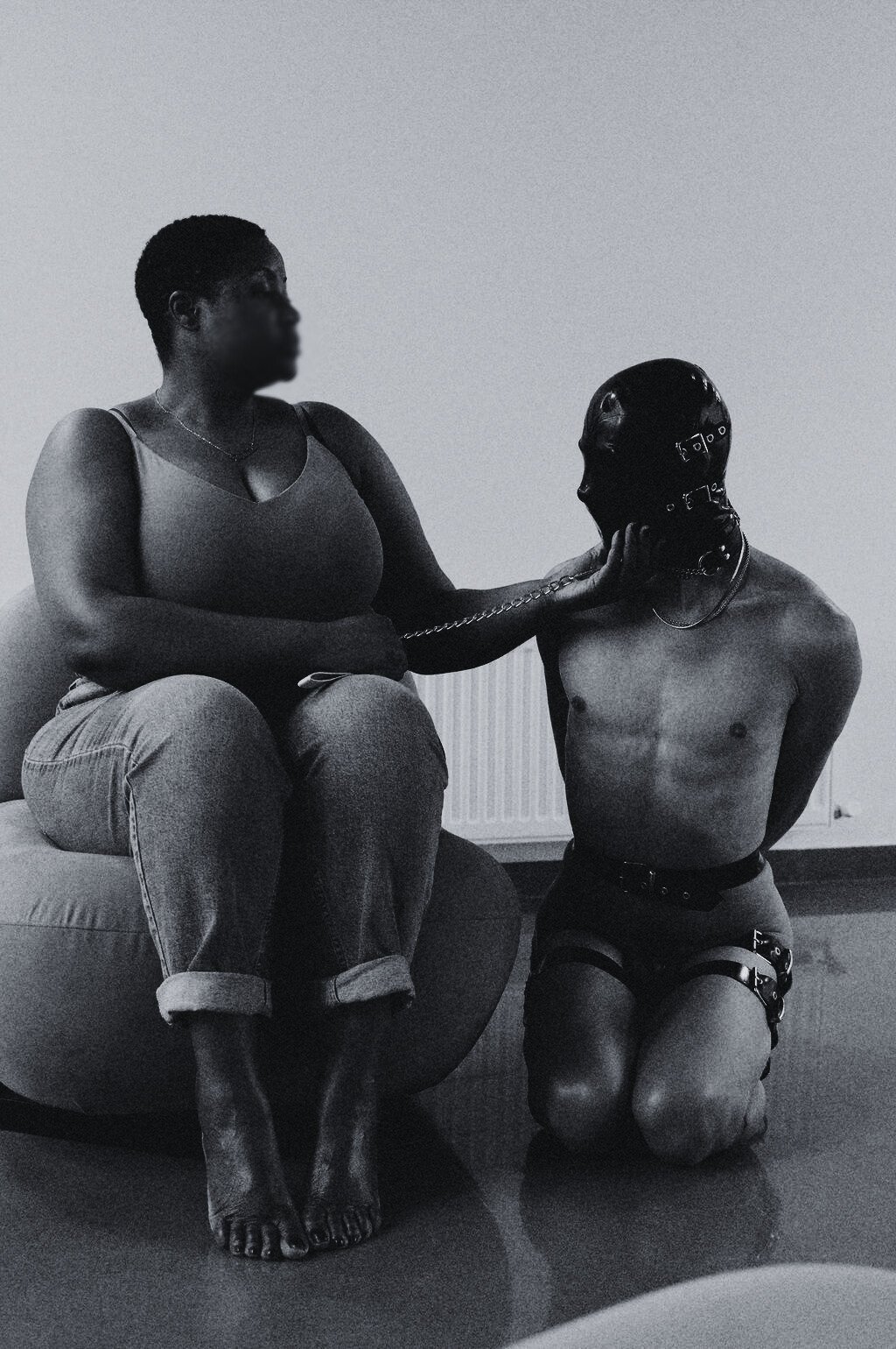 Cambridge dominatrix session with masked submissive