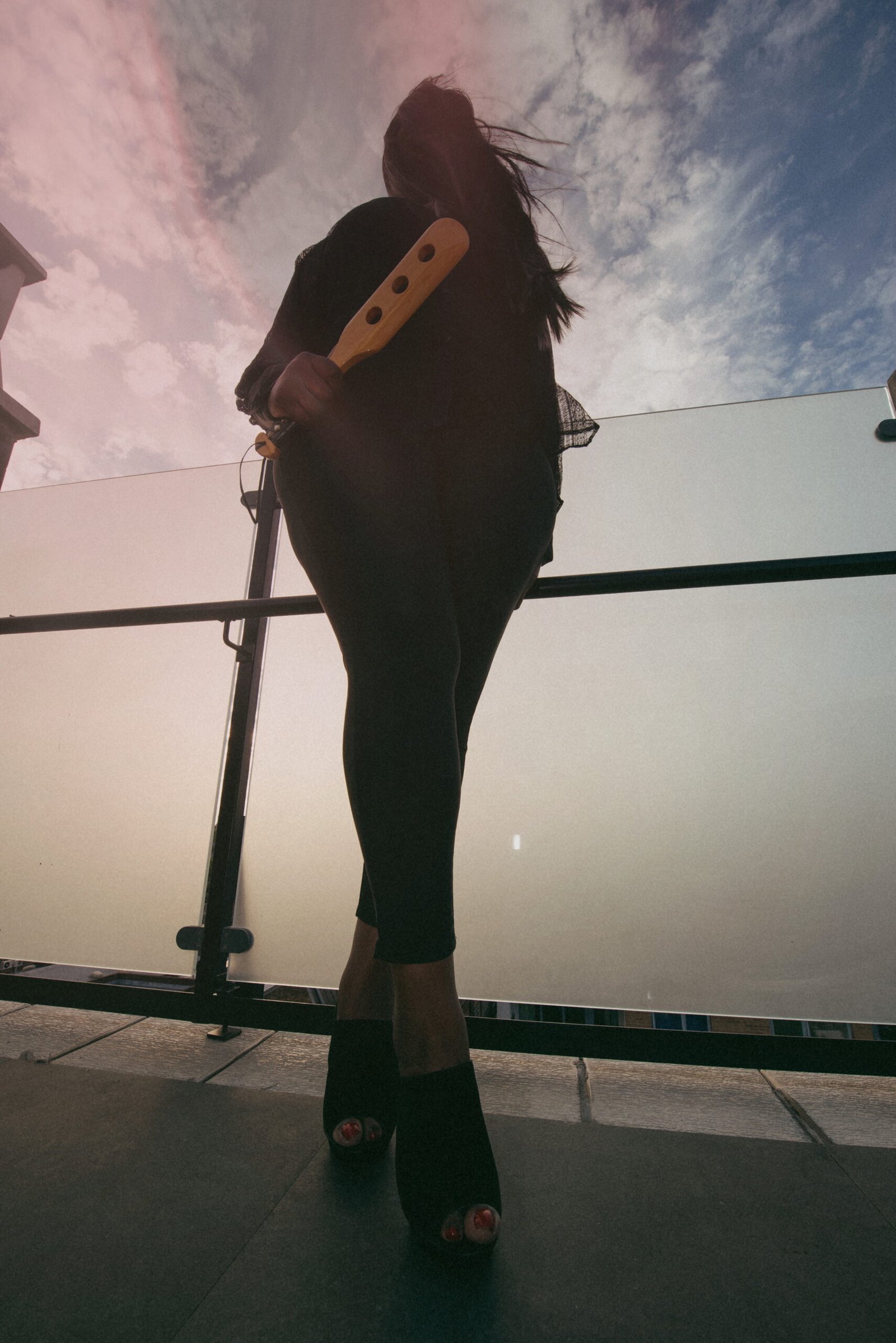 Dominant woman with discipline paddle